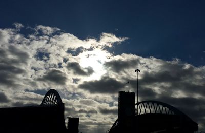 Low angle view of building against cloudy sky