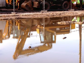 Reflection of man in lake