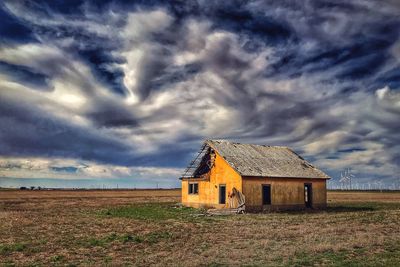 House on field against sky