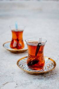Glass of tea served on table