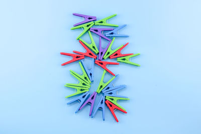 High angle view of colored pencils on white background