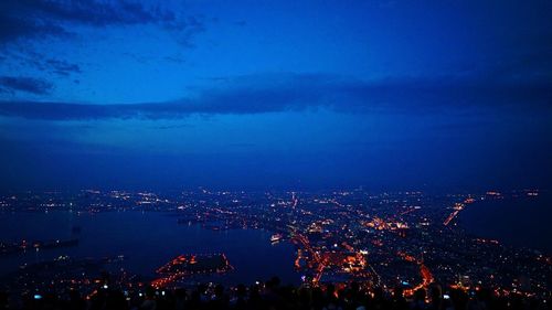 High angle view of illuminated city buildings at night