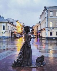 Statue in front of building