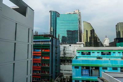 Low angle view of modern building against sky in city