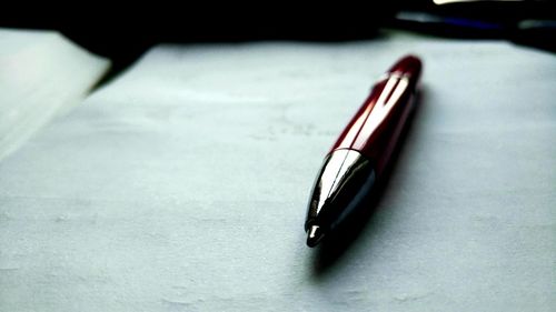 Close-up of pen on table