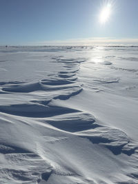 Scenic view of sea against clear sky during winter