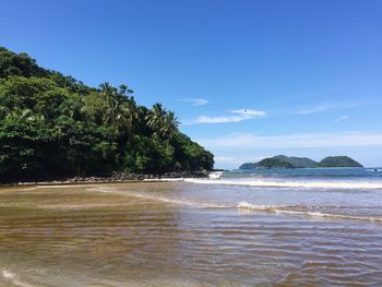 Scenic view of sea against blue sky