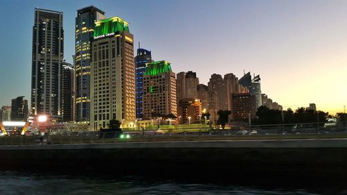 Illuminated buildings in city at night