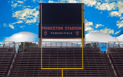 Low angle view of text on building against sky