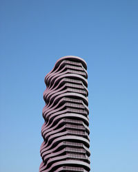 Low angle view of bell tower against blue sky