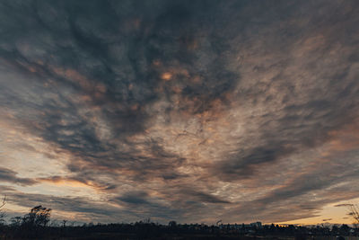 Low angle view of dramatic sky during sunset