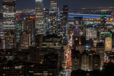 Illuminated buildings in city at night