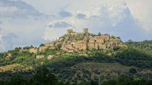 Clouds above tuscany middle age town