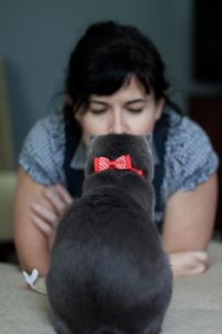 Close-up of smiling young woman sitting outdoors
