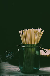 Close-up of food on table against black background