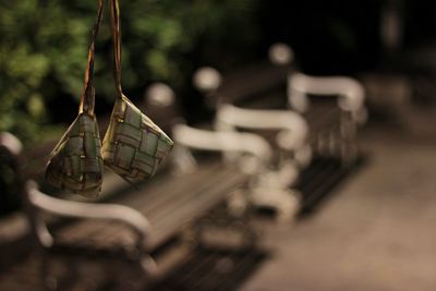 Close-up of empty bench in row