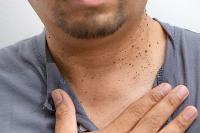 Close-up of young man against white background