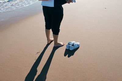 Low section of person on beach