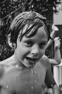 Portrait of shirtless boy in bathroom