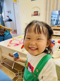 Portrait of smiling boy at home