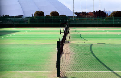 Scenic view of soccer field against sky