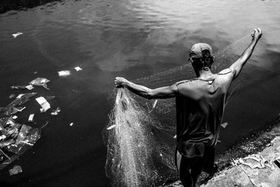 High angle view of man standing in river