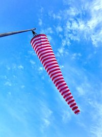 Low angle view of flags hanging against sky