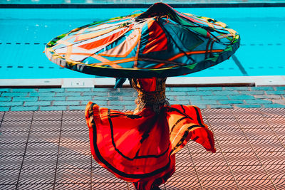 Clothes hanging on rope against sea