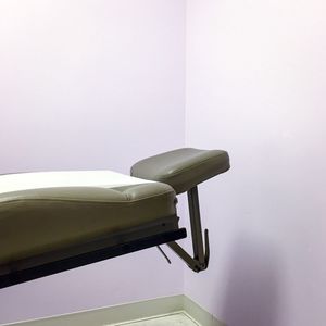 Close up of examination bed in doctor office 