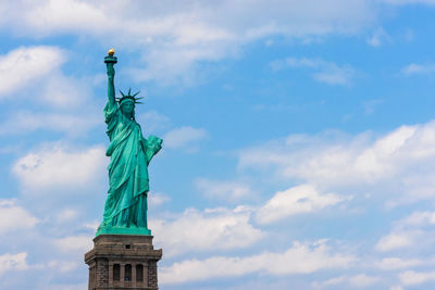 Low angle view of statue against sky