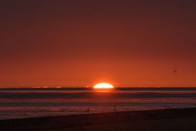 Scenic view of beach during sunset