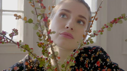 Portrait of girl with red flowers