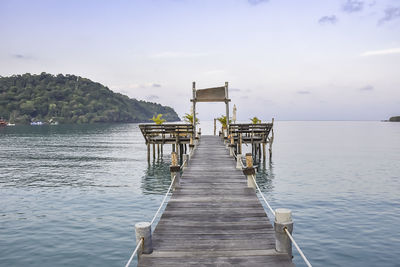 Pier over sea against sky