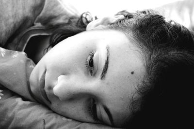 Close-up of young woman sleeping on bed