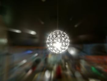 Low angle view of illuminated light bulb