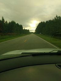 Close-up of road against sky during sunset