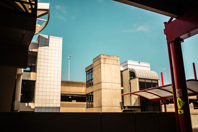 Low angle view of buildings against blue sky