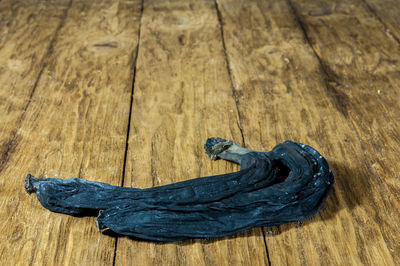 High angle view of shoes on wooden floor