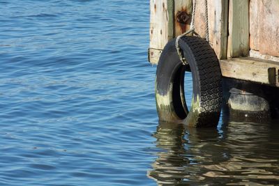 Close-up of tire in water