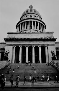 People walking in front of building