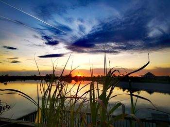 Scenic view of lake against sky during sunset