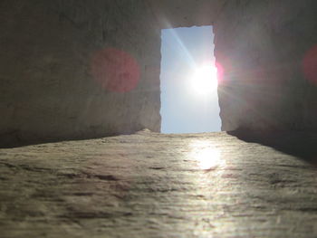 Sun shining through wall