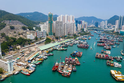 High angle view of sea and buildings in city