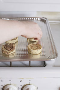 Midsection of person preparing food in kitchen