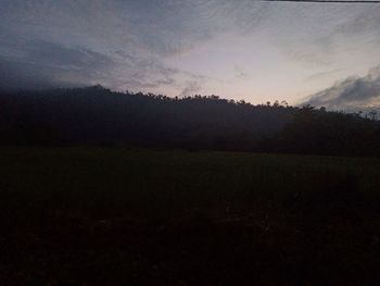 Scenic view of field against sky during sunset