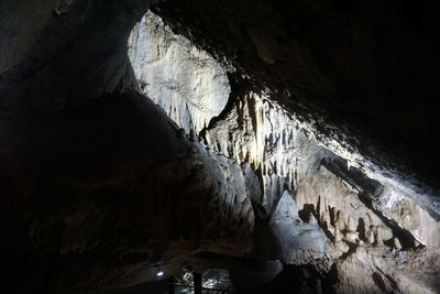 Low angle view of illuminated cave