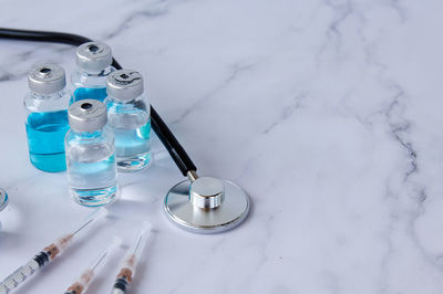 High angle view of bottles on table