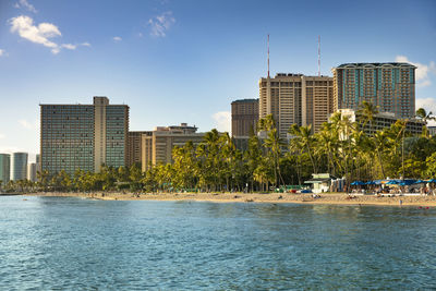 City by sea against sky