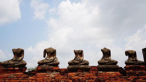 Low angle view of statue against cloudy sky