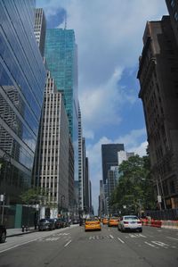 City street against cloudy sky